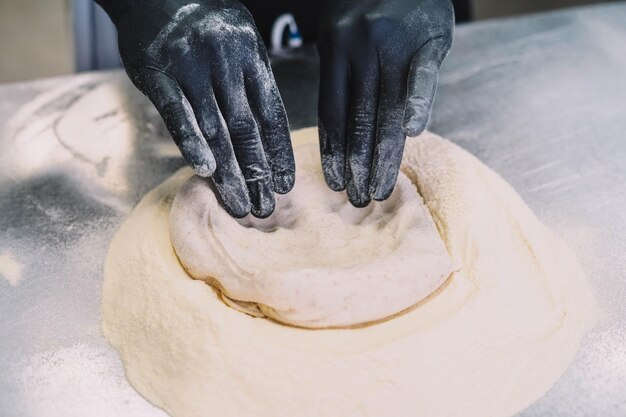 Preparation of a homemade Italian style pizza by a specialist