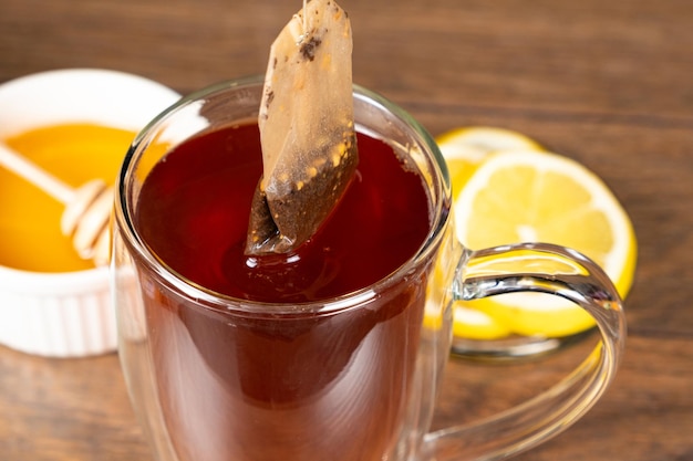 Preparation tea from a tea bag in a glass cup