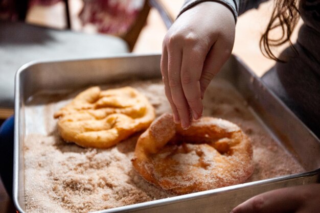 Photo the preparation of a traditional food sweet fritter called filhos from portugal christmas time