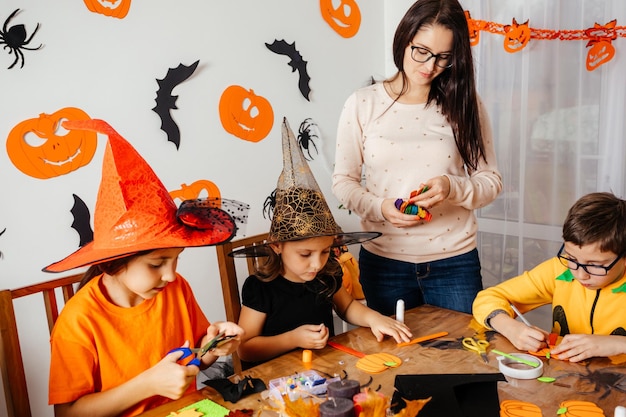 Preparations for autumn holidays doing craft with kids