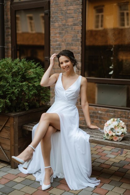 Preparations for the bride with the dressing of the wedding dress