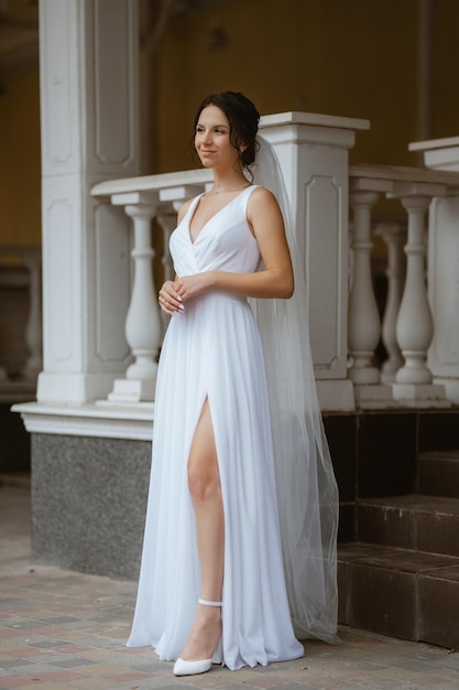 Preparations for the bride with the dressing of the wedding dress