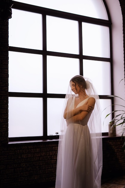 Preparations for the bride with the dressing of the wedding dress