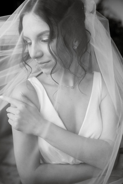 Preparations for the bride with the dressing of the wedding dress