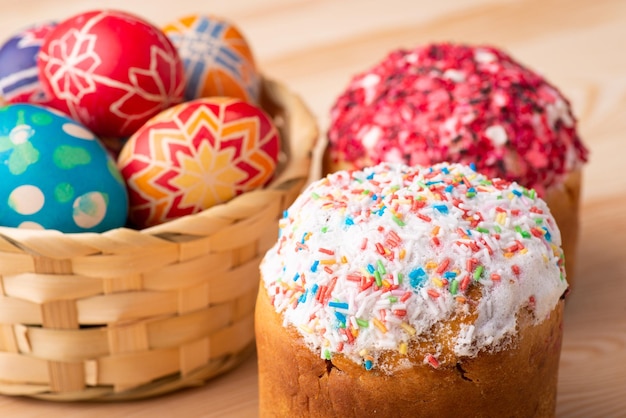 Preparations for celebrating Easter. Composition of Easter breads and Easter eggs on wooden table