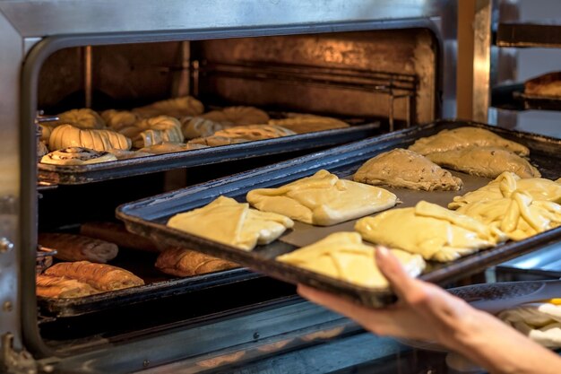 Prepare sweet pie in oven at small bakery