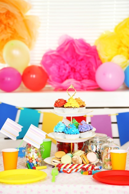 prepared birthday table with sweets for children party