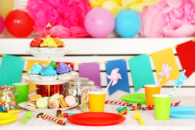 prepared birthday table with sweets for children party