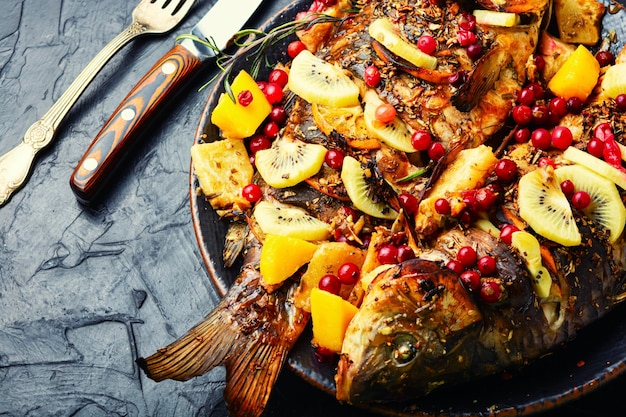 Prepared fish carp with fruits