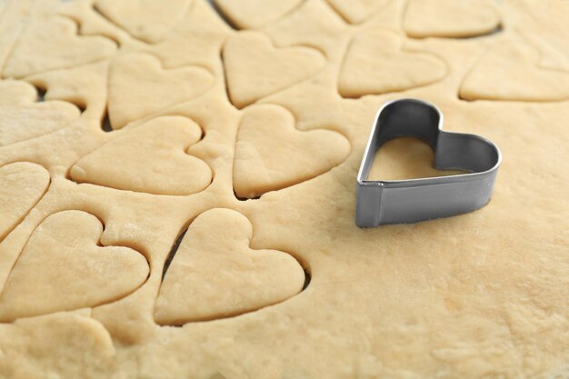 Preparing of butter cookies on table