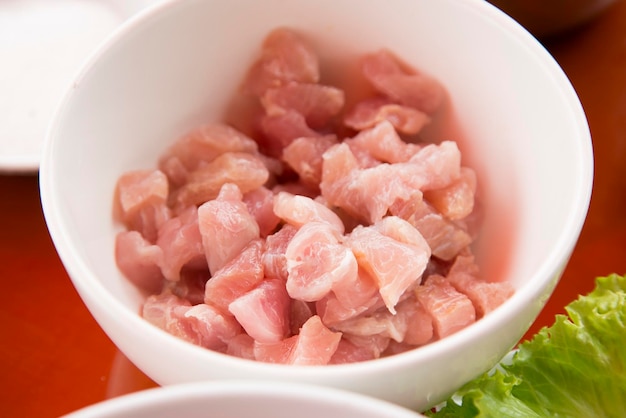 Preparing a delicious Peruvian sea bass ceviche in the fishing port of Chorrios in Lima.