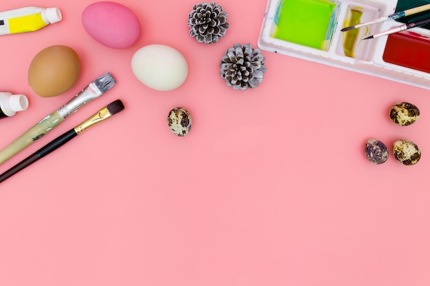 Preparing for Easter on pink background in flat lay