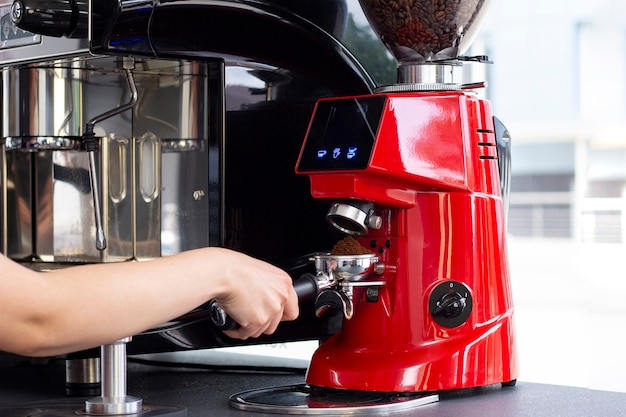 preparing espresso coffee in exclusive cafe bar