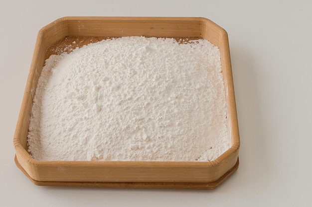 Preparing flour for baking in a sieve and being shifted showing the before and after of the flour