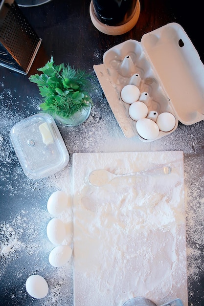 preparing food at home flour eggs background, ingredients for baking top view