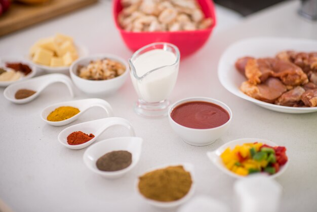 Preparing food in modern white kitchen