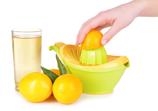 Photo preparing fresh lemon juice squeezed with hand juicer isolated on white