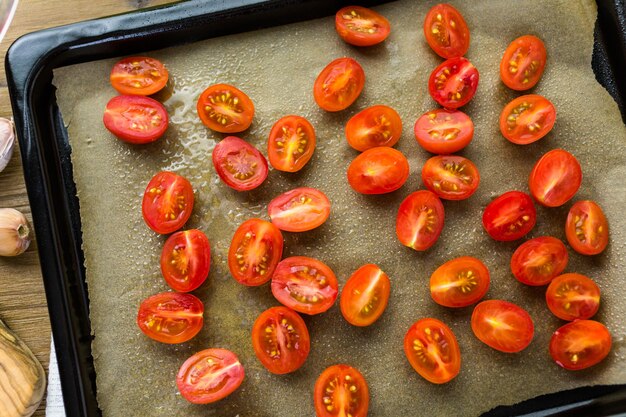 Photo preparing fresh roasted cherry tomatoes.