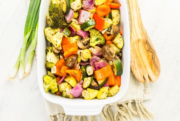 Preparing fresh roasted mixed vegetables for dinner.