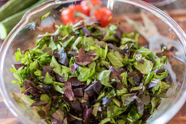 Preparing fresh salad with organic veggies.