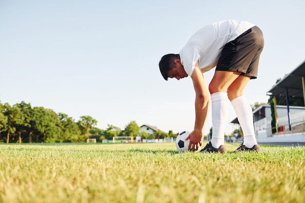 Preparing for the game Young soccer player have training on the sportive field