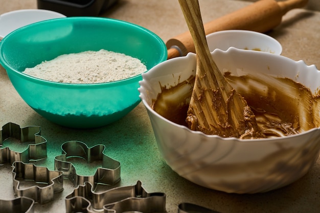 Preparing gingerbread dough ingredients and bowl paddle