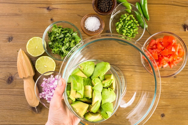 Preparing homemade guacamole from organic produce.