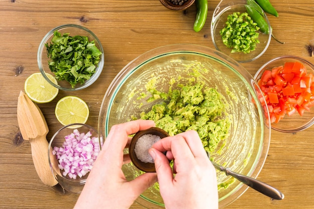 Preparing homemade guacamole from organic produce.