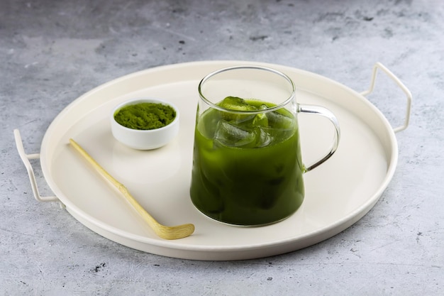 Preparing iced matcha green tea antioxidant matcha drink made of ground powder of green tea leaves