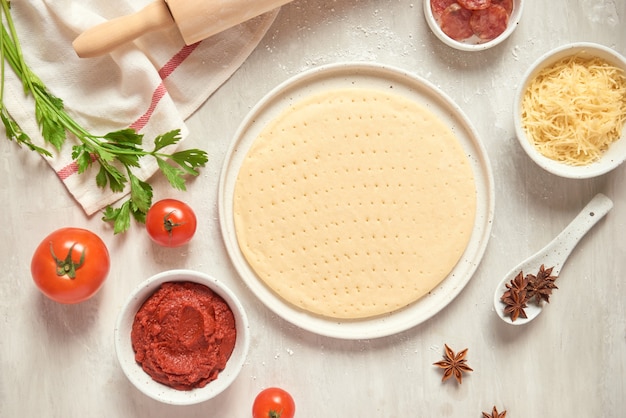 Preparing individual pizzas from pizza bar