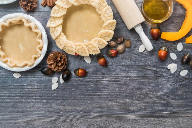 Preparing pie crusts for mini pumpkin pies.