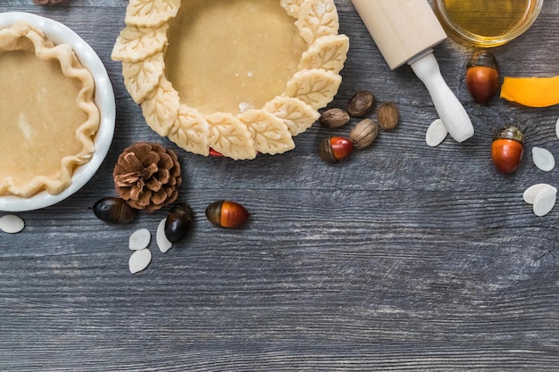 Preparing pie crusts for mini pumpkin pies.