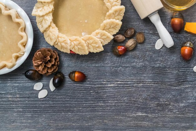 Preparing pie crusts for mini pumpkin pies.