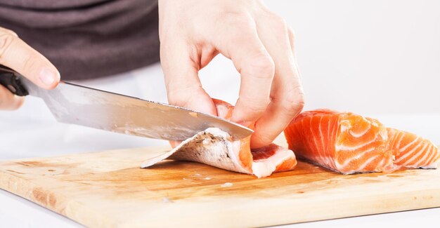 Photo preparing salmon in the cutting board.