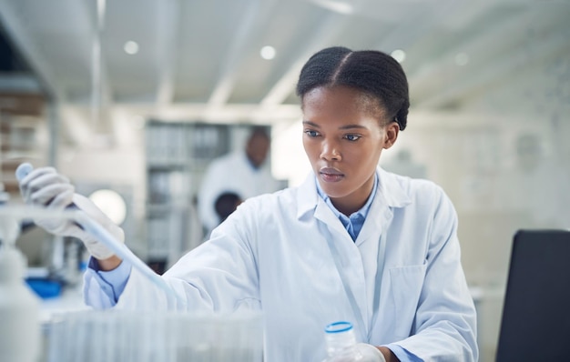 Preparing some samples for a new trial Shot of a young scientist working in a lab