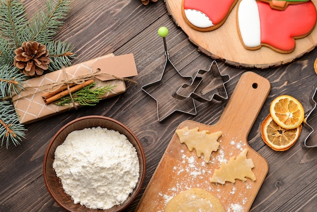 Preparing of tasty Christmas cookies on table