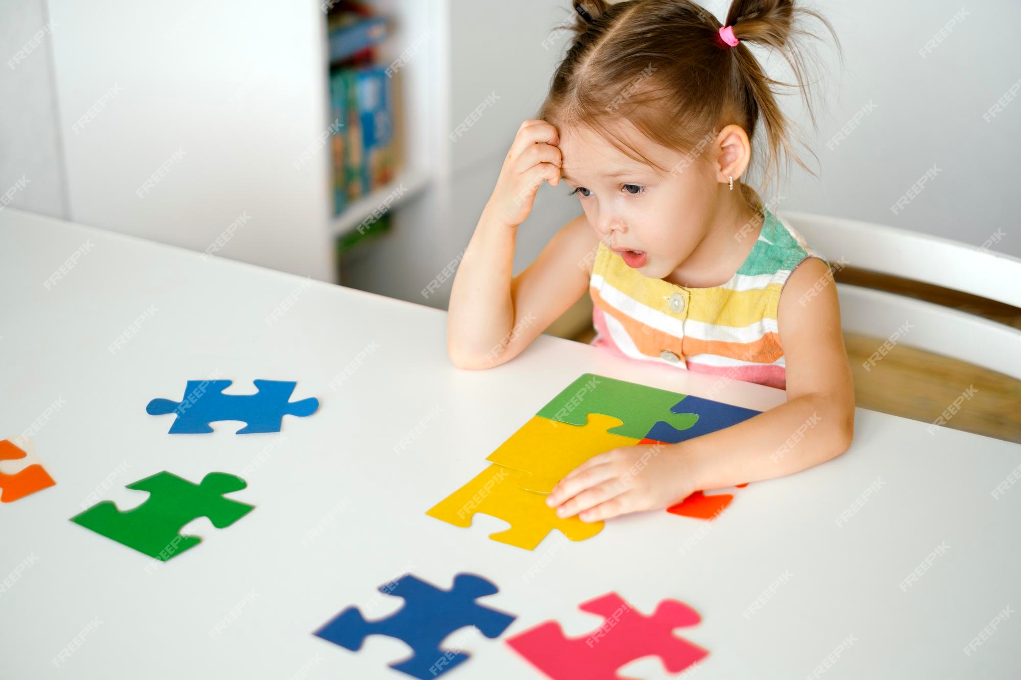 Little girl preschooler learning online solving puzzles playing educational  games on laptop at home - a Royalty Free Stock Photo from Photocase