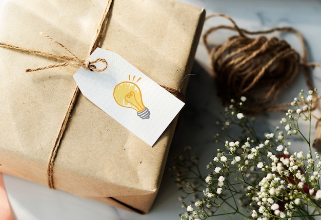 Present box with a light bulb tag