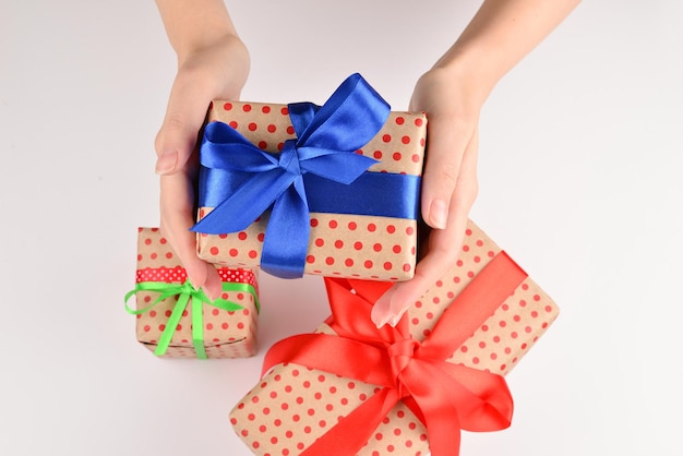 Present in woman hand on white background.