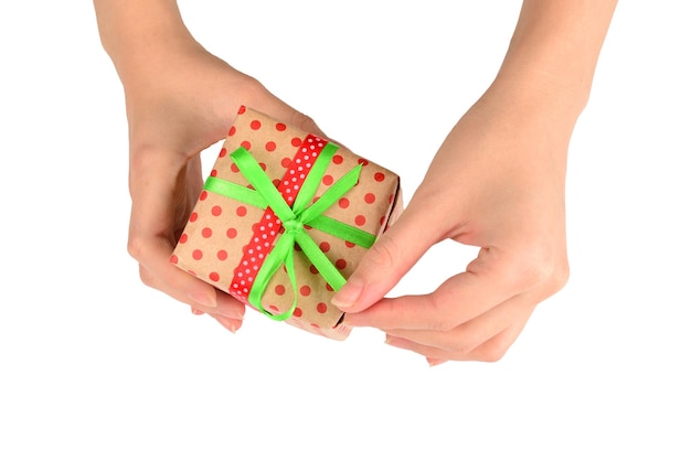 Present in woman hand on white background