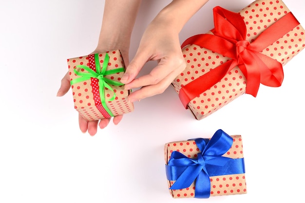 Present in woman hand on white background