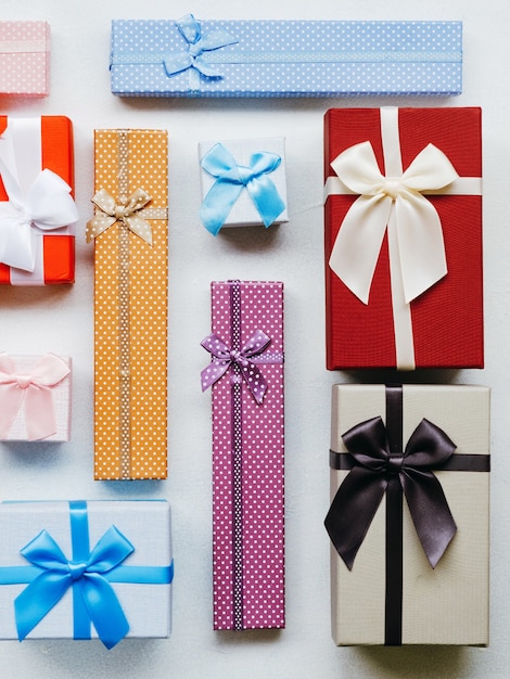 Present wrapping craft. Creative ideas of gifts packaging. Various decorative designs. Mix of boxes on white background