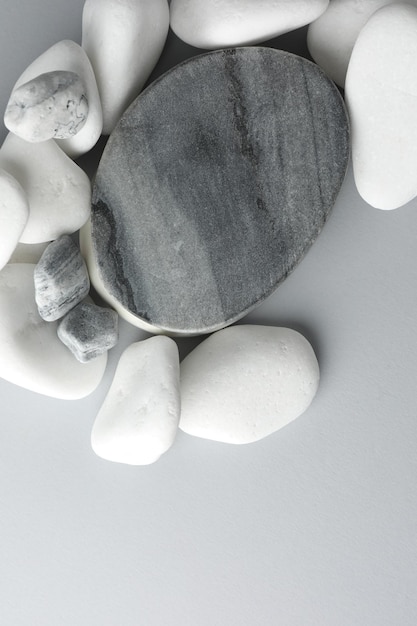 presentation for product stone podium and pebbles on light grey background top view space for text