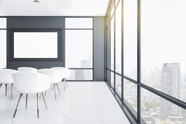 Presentation room with blank screen and city view