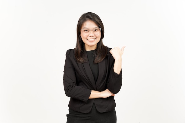 Presenting and Pointing Side Product Using Thumb Of Beautiful Asian Woman Wearing Black Blazer