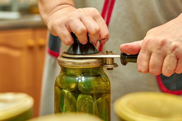 Preservation of fresh house cucumbers in glass jars using seamer