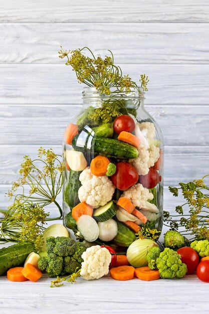 Preservation of vegetables in a glass jar. Preparing pickled vegetables.