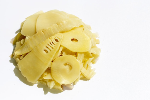 Preserved bamboo shoot slices on white background.