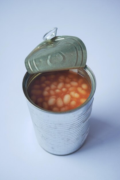 Preserved canned tomato beans on white