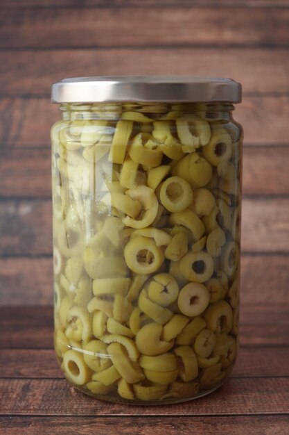 preserved olive in a jar on table